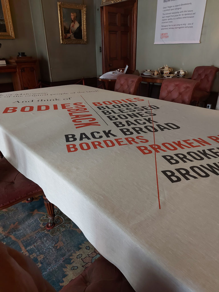 Printed to natural linen, the typographic tablecloth in the Dining Room makes a bold statement