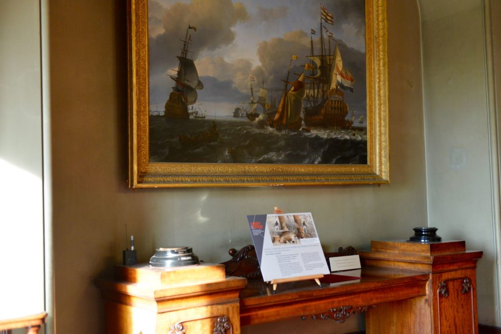 Interpretation panels are placed on the mahogany furniture in the Dining Room